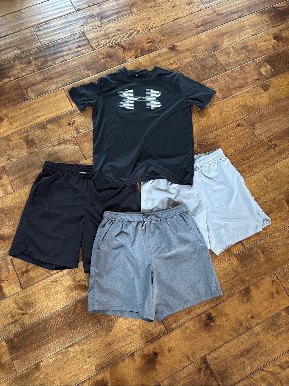Under Armour boys YXL shirt and three pair youth large athletic shorts.